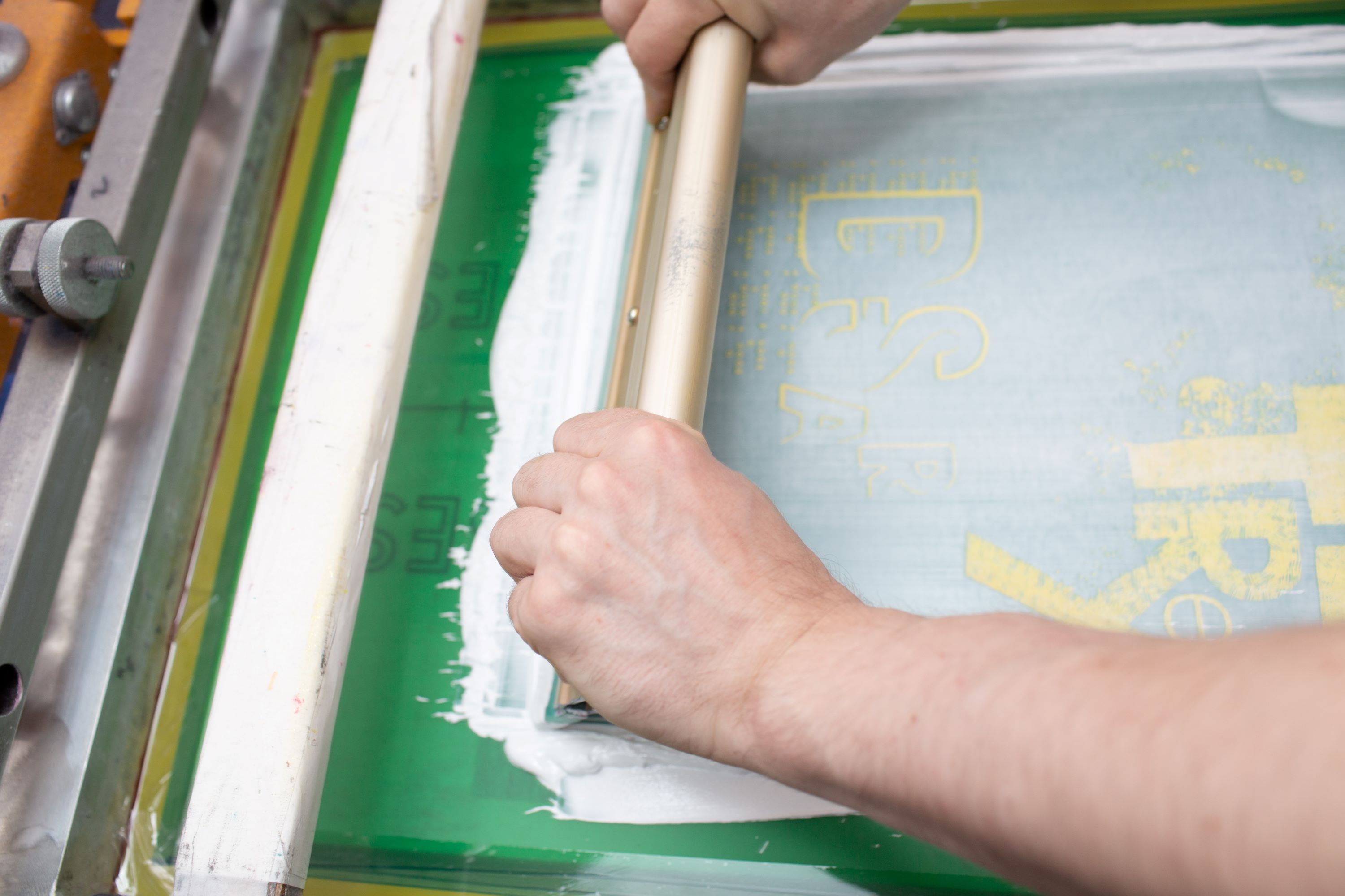 serigraphy-silk-screen-print-process-clothes-factory-frame-squeegee-plastisol-color-paints